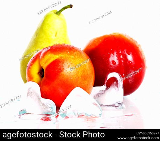Fresh and wet fruits and ice isolated over white