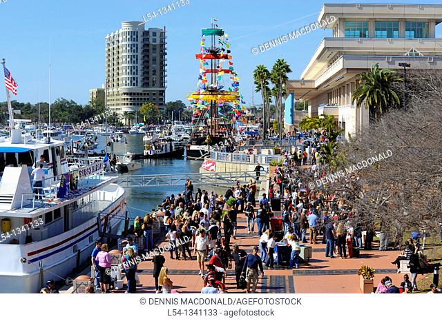 Crowd with boats downtown Tampa Gasparilla Pirate Festival