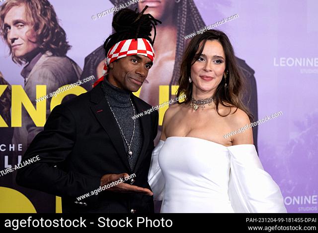 04 December 2023, Bavaria, Munich: Bella Dayne, actress, and Fabrice Morvan, former member of Milli Vanilli, attend the world premiere of the film ""Girl You...