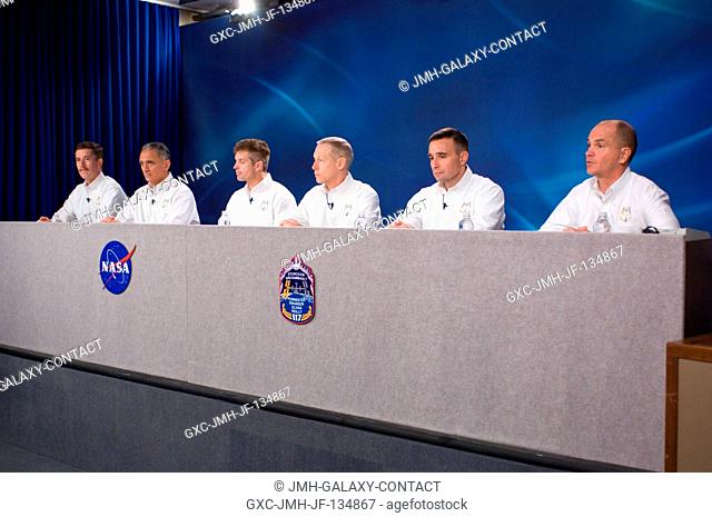 The STS-117 crewmembers are photographed during a pre-flight press conference at Johnson Space Center. From the right are astronauts Rick Sturckow and Lee...