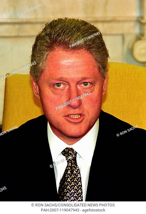 United States President Bill Clinton meets with reporters in the Oval Office of the White House in Washington, DC to discuss the situation in Iraq following the...
