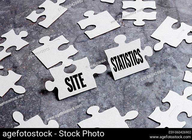 Handwriting text Site Statistics, Business concept measurement of behavior of visitors to certain website Building An Unfinished White Jigsaw Pattern Puzzle...