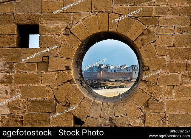 Circular window in the wall of the Sqala du Port walkway to the Essaouira Citadel; Essaouira, Morocco
