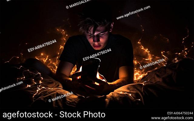 Addicted young guy in bed sitting on the Internet on his smartphone, sleepy and tired at night. concepts of mobile addiction and excessive use of technology
