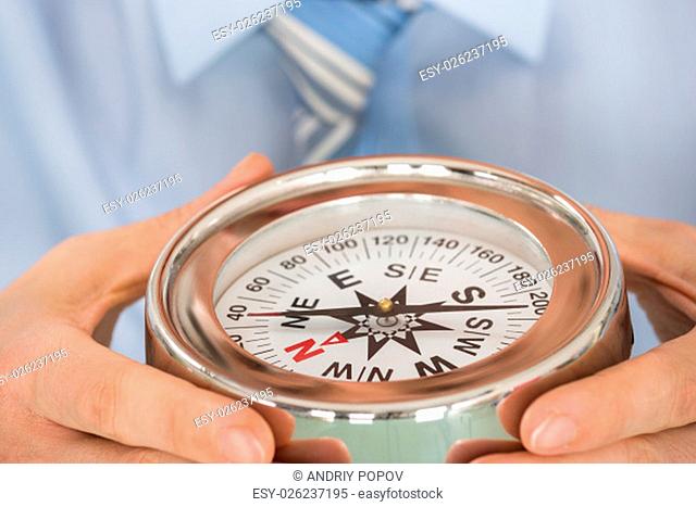 Close-up Photo Of Person Hand Holding Compass