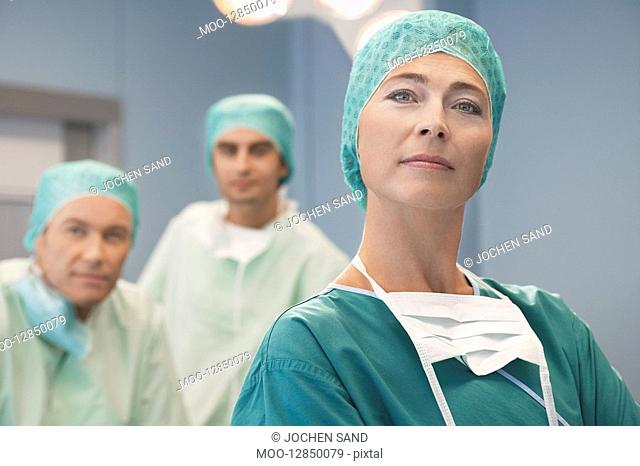 Head of Surgical Team with surgeons in operating theatre portrait