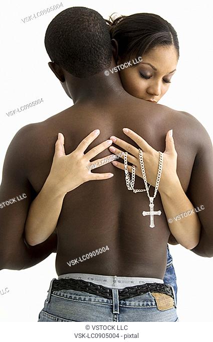 African American couple holding each other