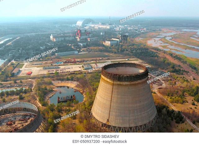 Chernobyl nuclear power plant. Cooling tower overlooking the nuclear power plant in Chernobyl. View of the destroyed nuclear power plant