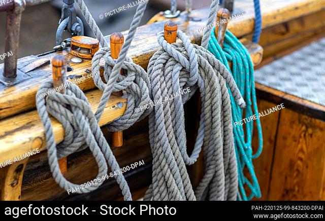 25 January 2022, Mecklenburg-Western Pomerania, Greifswald: Ropes and cables are coiled on the side of the missionary cutter ""Elida"", built in 1939