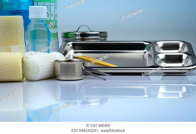Wound care dressing set and stainless steel plate, forceps, iodine cup, conform bandage, elastic cohesive retention bandage, antiseptic and normal saline bottle