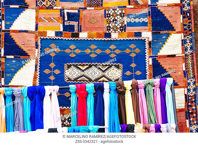Scarves and traditional Moroccan carpets in a store in Ouarzazate, Drâa-Tafilalet, Morocco, North Africa
