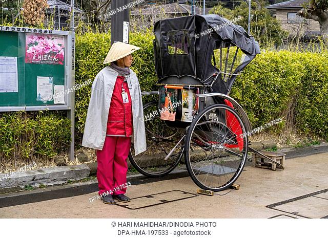 Hand rickshaw puller, kamakura, japan