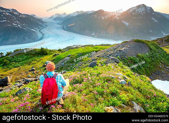 Hiking man in Canadian mountains. Hike is the popular recreation activity in North America. There are a lot of picturesque trails