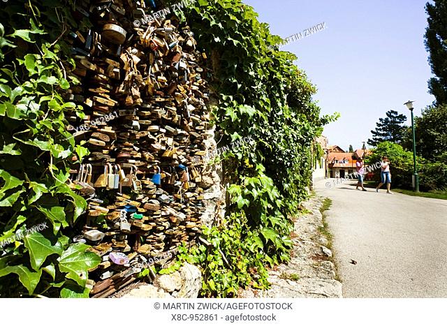 padlocks of fidelity, trust, faithfulness locked to a fence in Tata  As Symbol for forever love lovers lock the padlocks on the fence and throw the key in the...