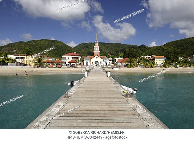 France, Martinique (French West Indies), Les Anses d'Arlet, pontoon and boat and view on the church and the village of Anse d'Arlet