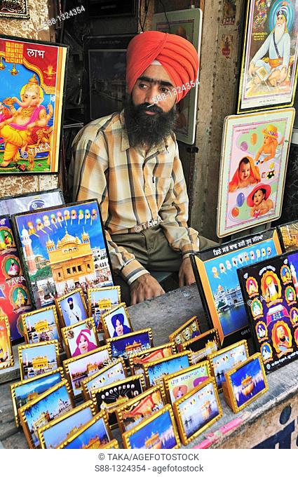 Sikh man sell holly pictures from Amritsar