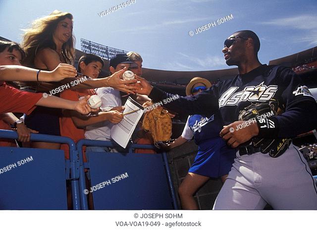 Professional Baseball player signing autographs and balls for young fans, Dodger Stadium, Los Angeles, CA
