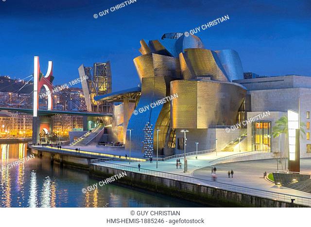 Spain, Basque Country Region, Vizcaya Province, Bilbao, Guggenheim Museum by architect Frank Gehry and Salve bridge with Les Arches Rouges artpiece by French...