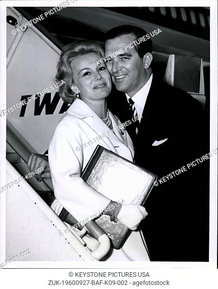 Sep. 27, 1960 - Glamorous Eva Gabor receives an affectionate Hug from her Seldom photographed husband, Richard Brown before she boarded a TWA Superjet for Los...