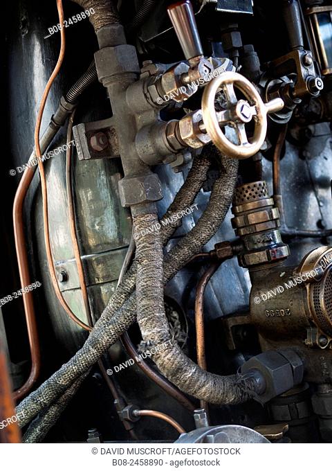 controls of a vintage steam locomotive at Loughborough station, on the Great Central Railway in Leicestershire, UK