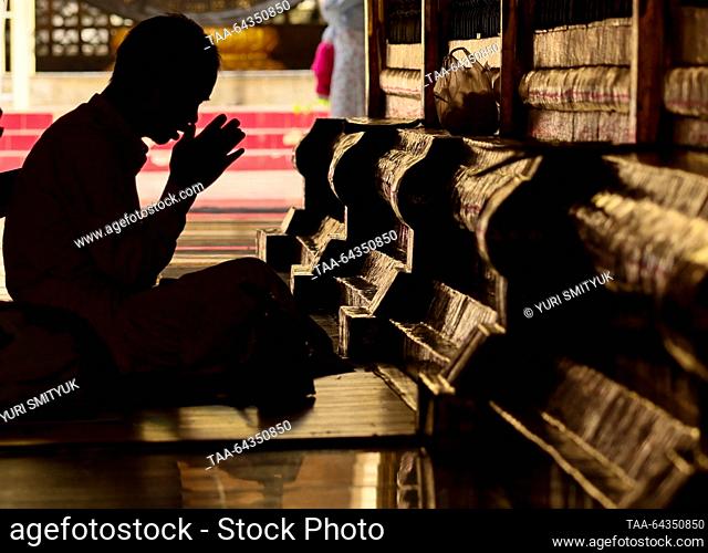 MYANMAR, MANDALAY - OCTOBER 25, 2023: A man prays at the Mahamuni Buddha Temple. Yuri Smityuk/TASS