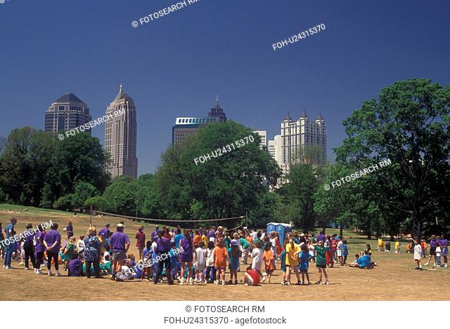 Atlanta, GA, Georgia, School volleyball game at Piedmont Park, downtown skyline