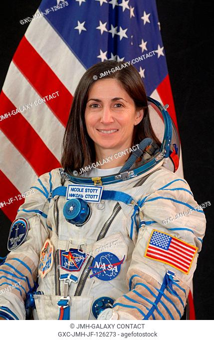 Astronaut Nicole Stott, Expedition 2021 flight engineer, attired in a Russian Sokol launch and entry suit, takes a break from training in Star City