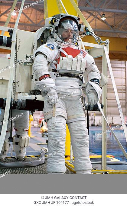 Astronaut Philippe Perrin, STS-111 mission specialist, attired in a training version of the Extravehicular Mobility Unit (EMU) space suit