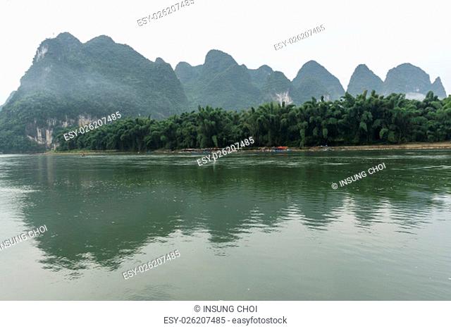 the famous 20 yuan banknote scenery taken early in the morning when the li river is calm. Taken in xingping, guilin, china. During summer