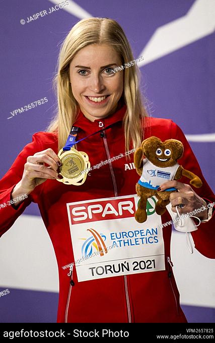 Belgium's Elise Vanderelst celebrates on the podium after winning the women 1500m race at the European Athletics Indoor Championships, in Torun, Poland