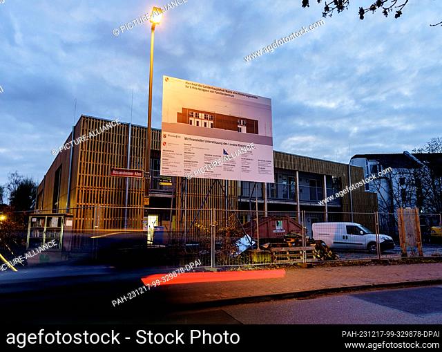 PRODUCTION - 15 December 2023, Rhineland-Palatinate, Mainz: A car drives past the ""MinniMax"" daycare center in the Laubenheim district