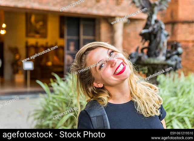 Young blonde tourist landing in front of Ricardo Brennand Institute in Recife, Brazil