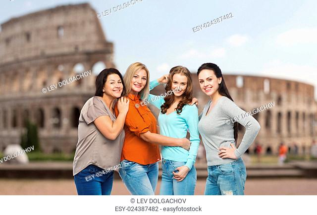 friendship, travel, tourism, diverse and people concept - group of happy different size women in casual clothes over rome coliseum background
