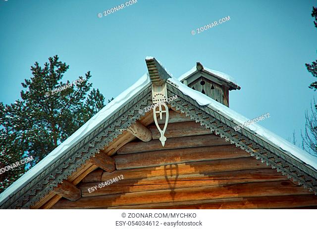 Russian Traditional wooden architecture - Chudsky konek , Top log on the roof of the houseMalye Karely village, Arkhangelsk region, Russia
