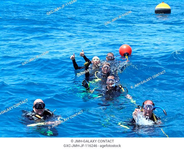 Equipped with SCUBA gear, NASA Extreme Environment Mission Operations (NEEMO) 14 crew members and support team are pictured during training activities for the...