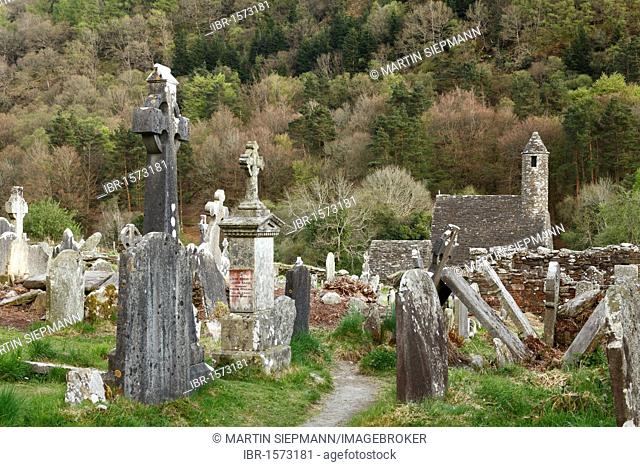 Chapel of St. Kevin's Kitchen and cemetery, former monastery Glendalough, Wicklow Mountains, County Wicklow, Republic of Ireland, British Isles, Europe