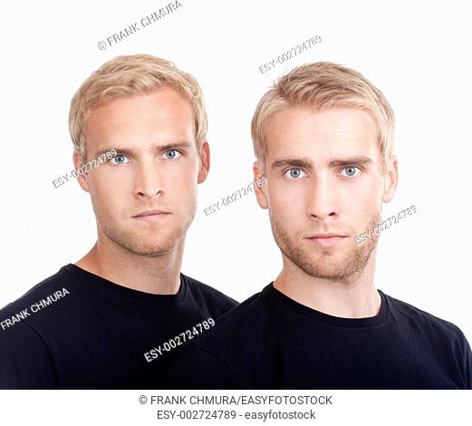 portrait of young twin brothers with blond hair and blue eyes - isolated on white