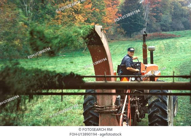 farmer in fairfield vt cutting hay farming farm