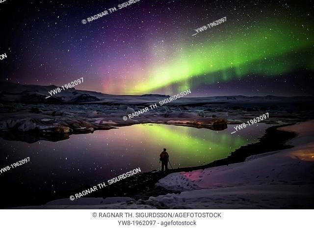 Taking pictures of the Aurora Borealis or Northern lights at the Jokulsarlon, Breidamerkurjokull, Vatnajokull Ice Cap, Iceland