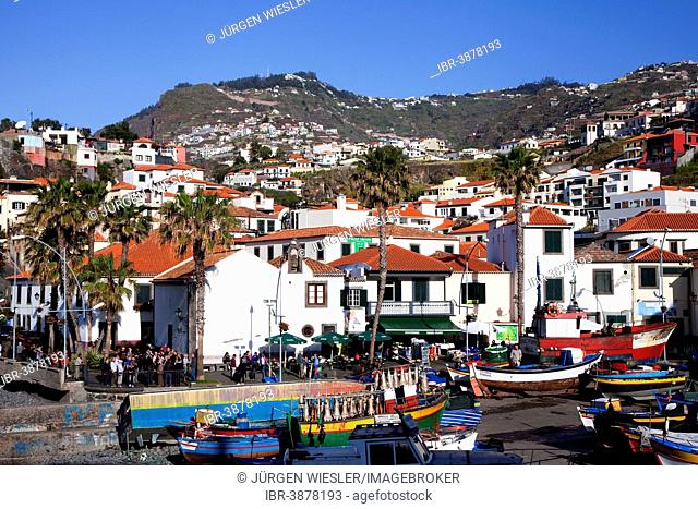 Bustling tourist life in the fishing village of Camara dos Lobos, Madeira, Portugal