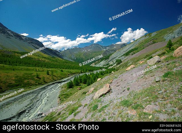 Mountain landscape. Highlands, the mountain peaks, gorges and valleys. The stones on the slopes