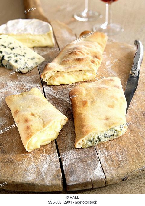 Assortment of cheese pizza turnovers