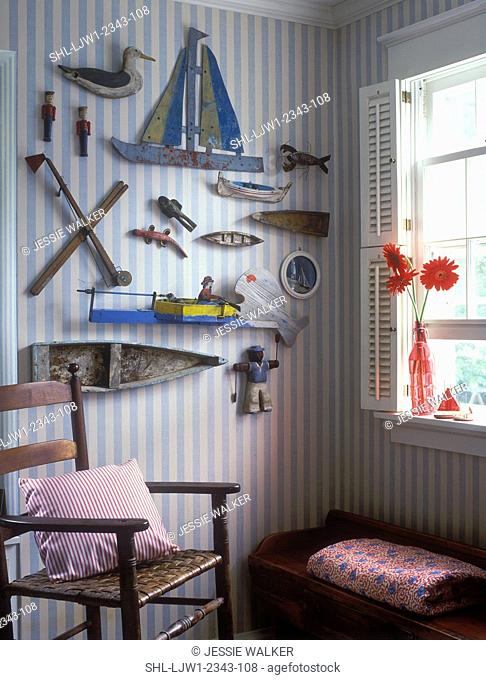 COLLECTION DISPLAY- Nautical theme, vintage boat models, antique toys, wall display, striped wallpaper, gerberas in rd glass vase on window sill, shutters