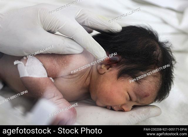 GRAPHICS - 08 February 2023, Syria, Afrin: A newborn girl lies on an incubator as part of her medical checkup at a children's hospital in the Syrian town of...