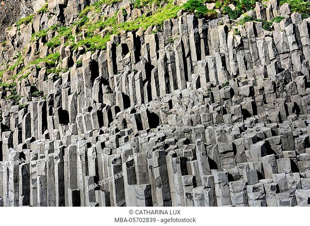 At the black sandy beach of Reynisfjara, basalt colums