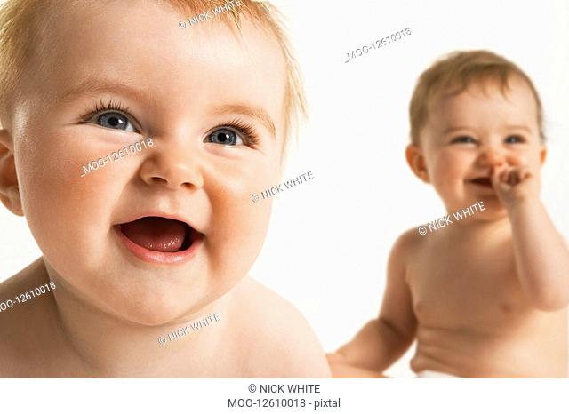 Laughing baby with spiky hair Stock Photos and Images | agefotostock