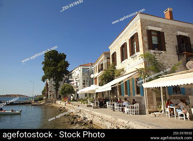 View to the traditional houses used as an open-air cafe at Smaller Sea-Küçükdeniz district of Old Foca, the ancient Phokaia, Foca, Izmir, Aegean Region, Turkey