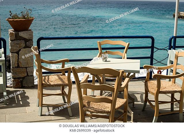 Table and chairs of a restaurant in Chora Sfakion, Crete, Greece