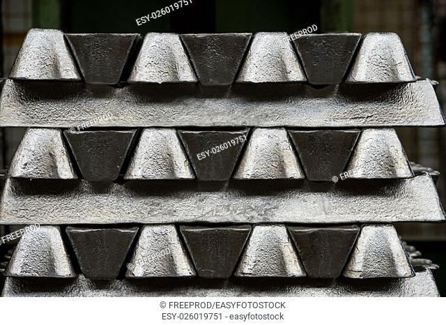 Stack of raw aluminum ingots in aluminum profiles factory, France