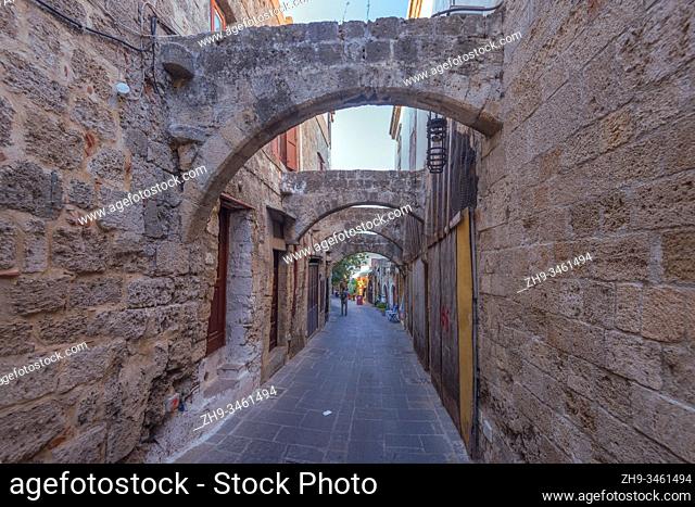 Narrow street in the medieval city inside of Fortifications of Rhodes. Greece